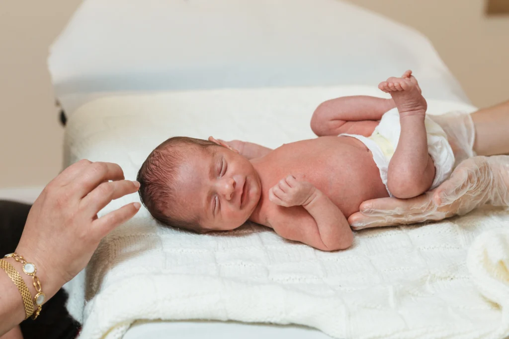 Pediatric physiotherapist performs an evaluation of the primary respiratory movement in newborn baby - A Complete Guide to Tylenol for Newborns - Kare One Support NICU 